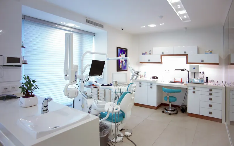 A modern dental treatment room with a patient chair
